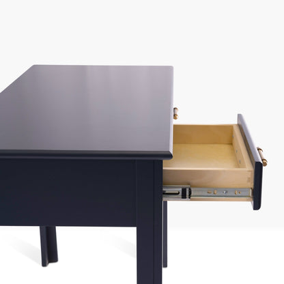 Acadia Cottage Writing Desk with two drawers. Pictured in denim finish from the side to highlight drawer glides.