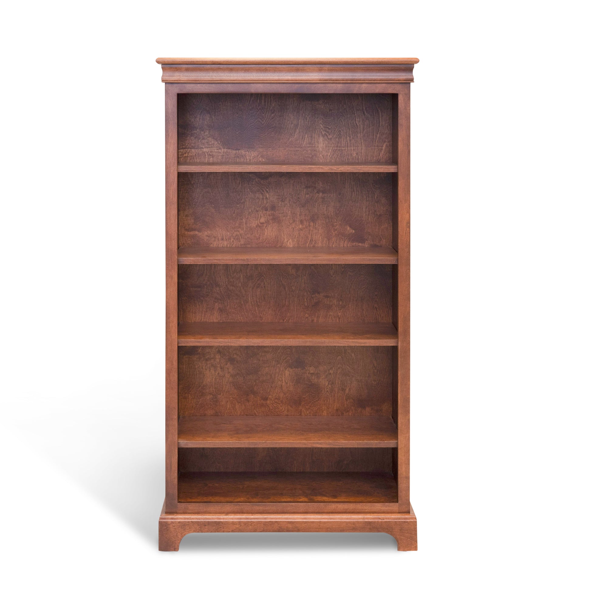 Acadia Madison Bookcase is built in birch and is 12 inches deep, featuring adjustable shelving and crown moulding. Shown in Walnut finish with empty shelves.