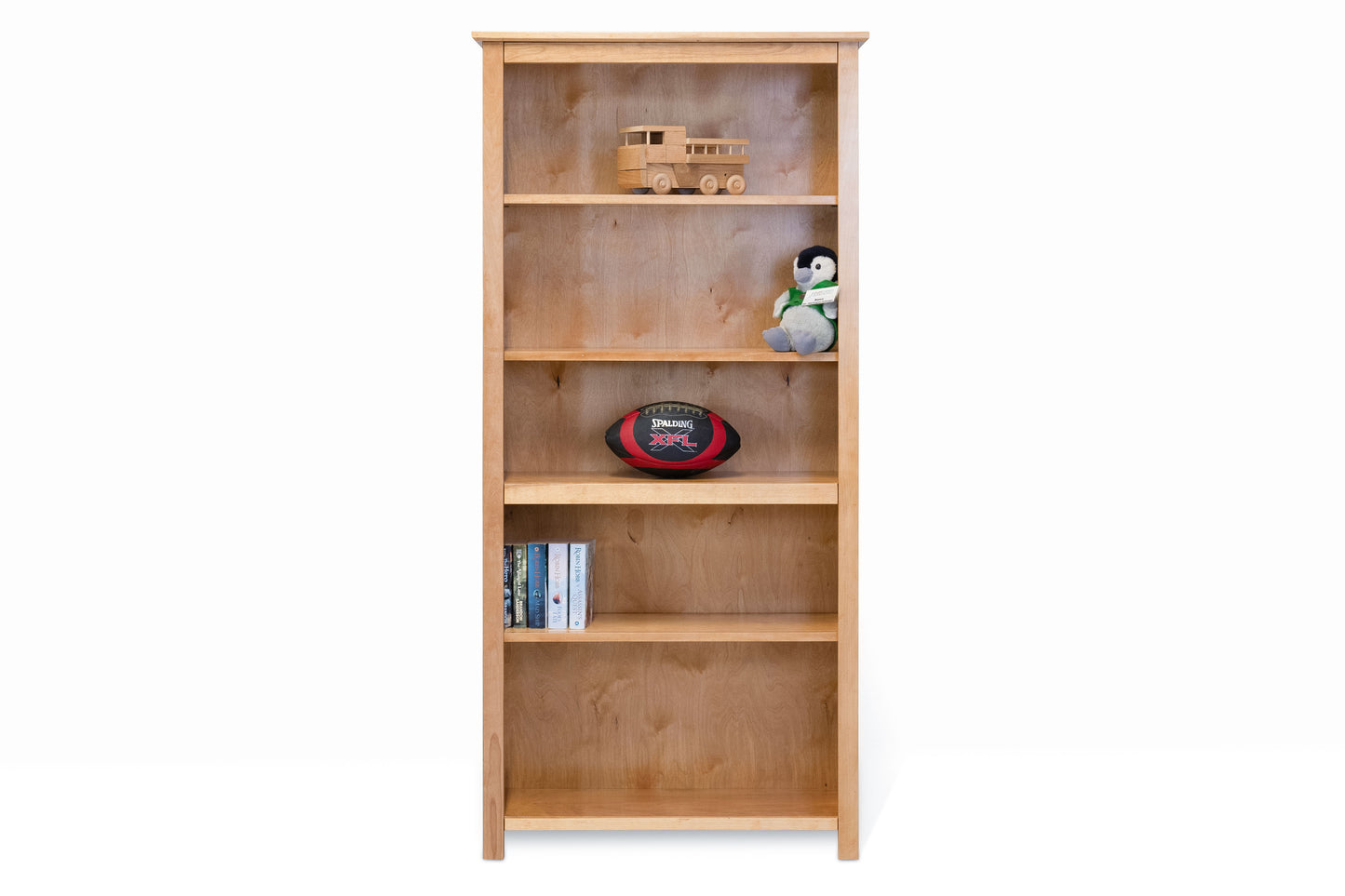 Berkshire Arlington Bookcase is built in birch and features adjustable shelves. Pictured in legacy cherry finish.
