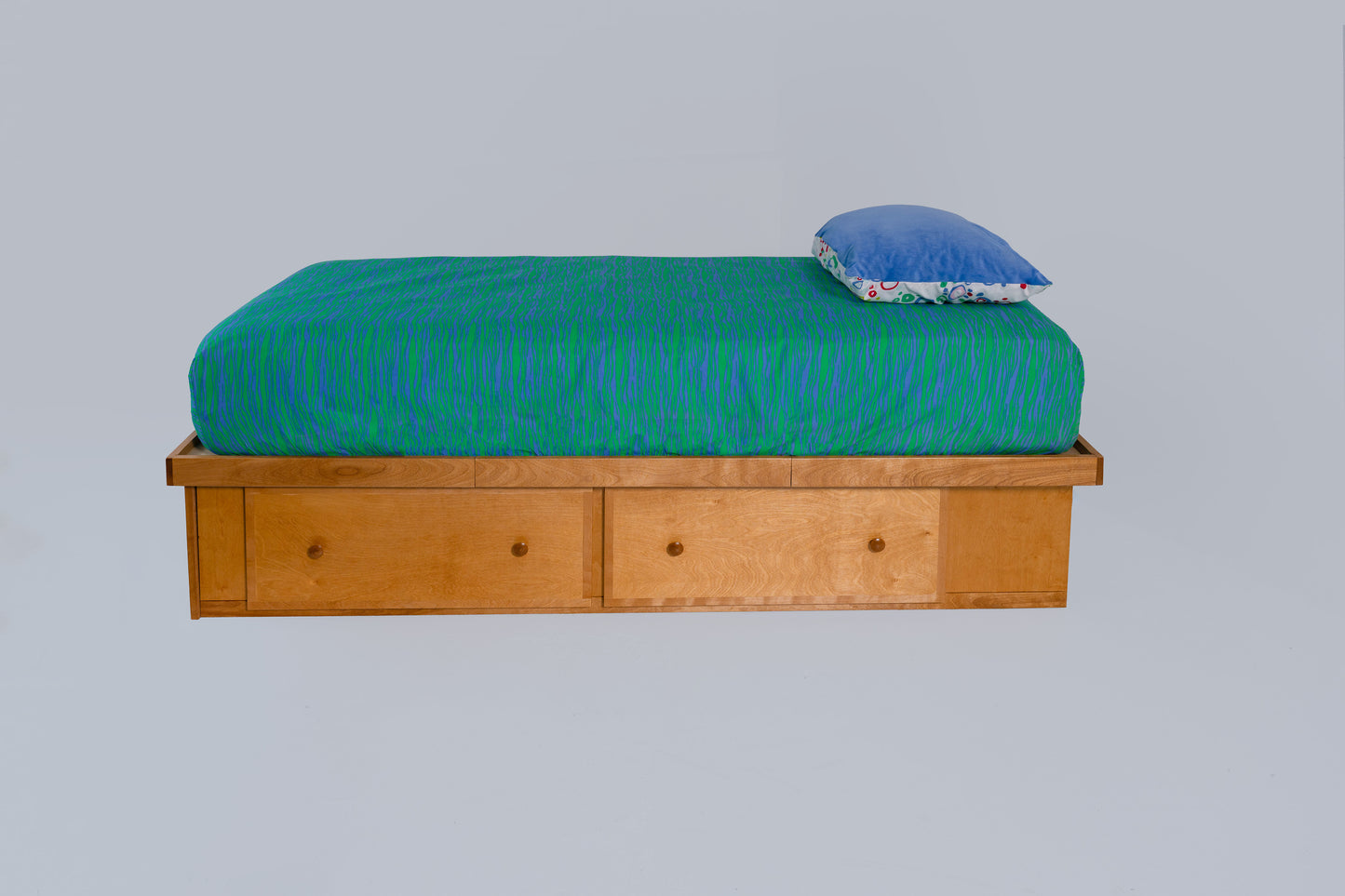 Berkshire Low Storage bed featuring two drawers in a twin size. Golden Oak finish is pictured.