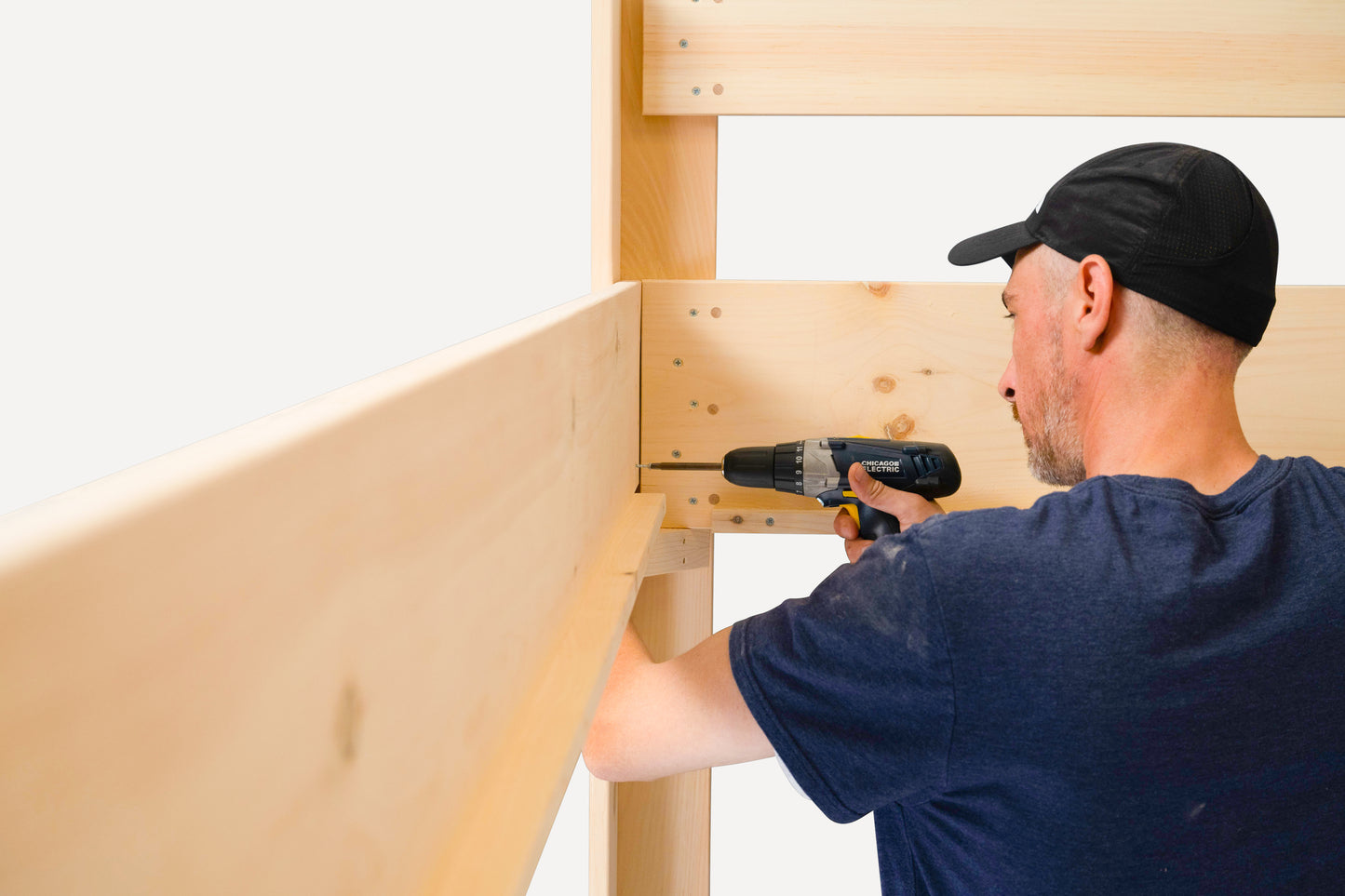 Close up of assembly process for loft bed in solid pine.