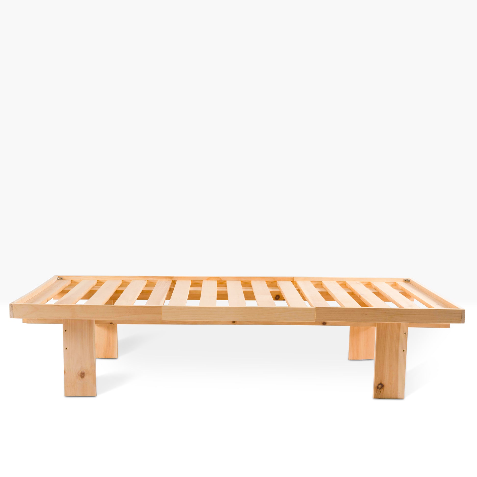 Evergreen Slat Bed shown from the side, constructed from unfinished white pine.