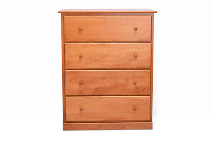 Acadia Cottage Chest: 4 drawers, rustic charm, nutmeg finish. Pictured from the front.