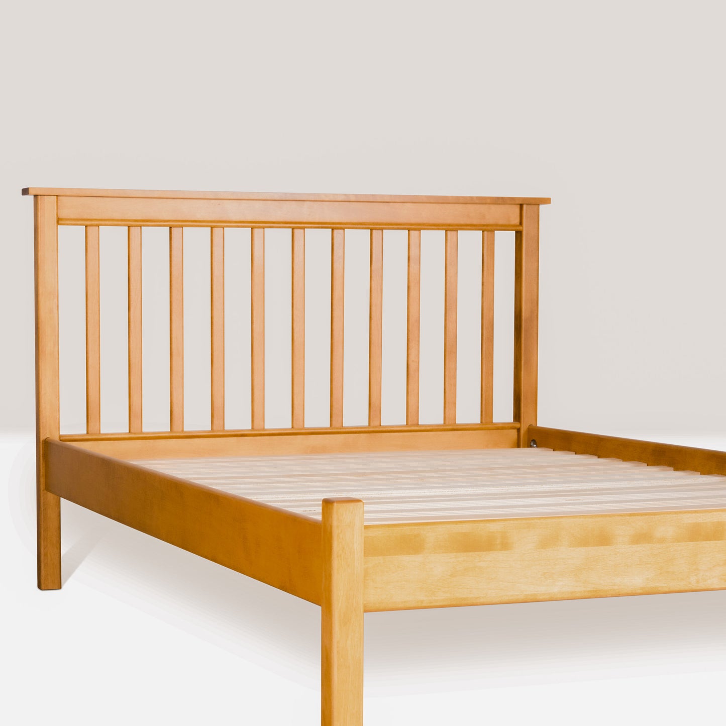 Acadia Shaker Platform Bed in Autumn Gold finish. Pictured at angle to show headboard details.