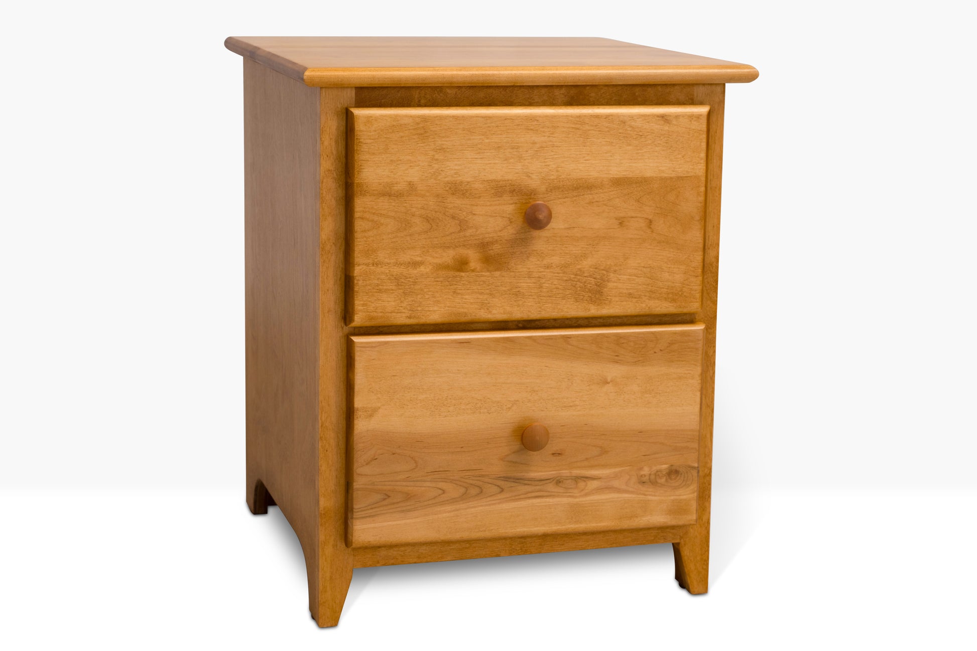 Acadia Shaker Two Drawer Nightstand is built from birch and features two drawers. Pictured in Autumn Gold finish from a side angle.