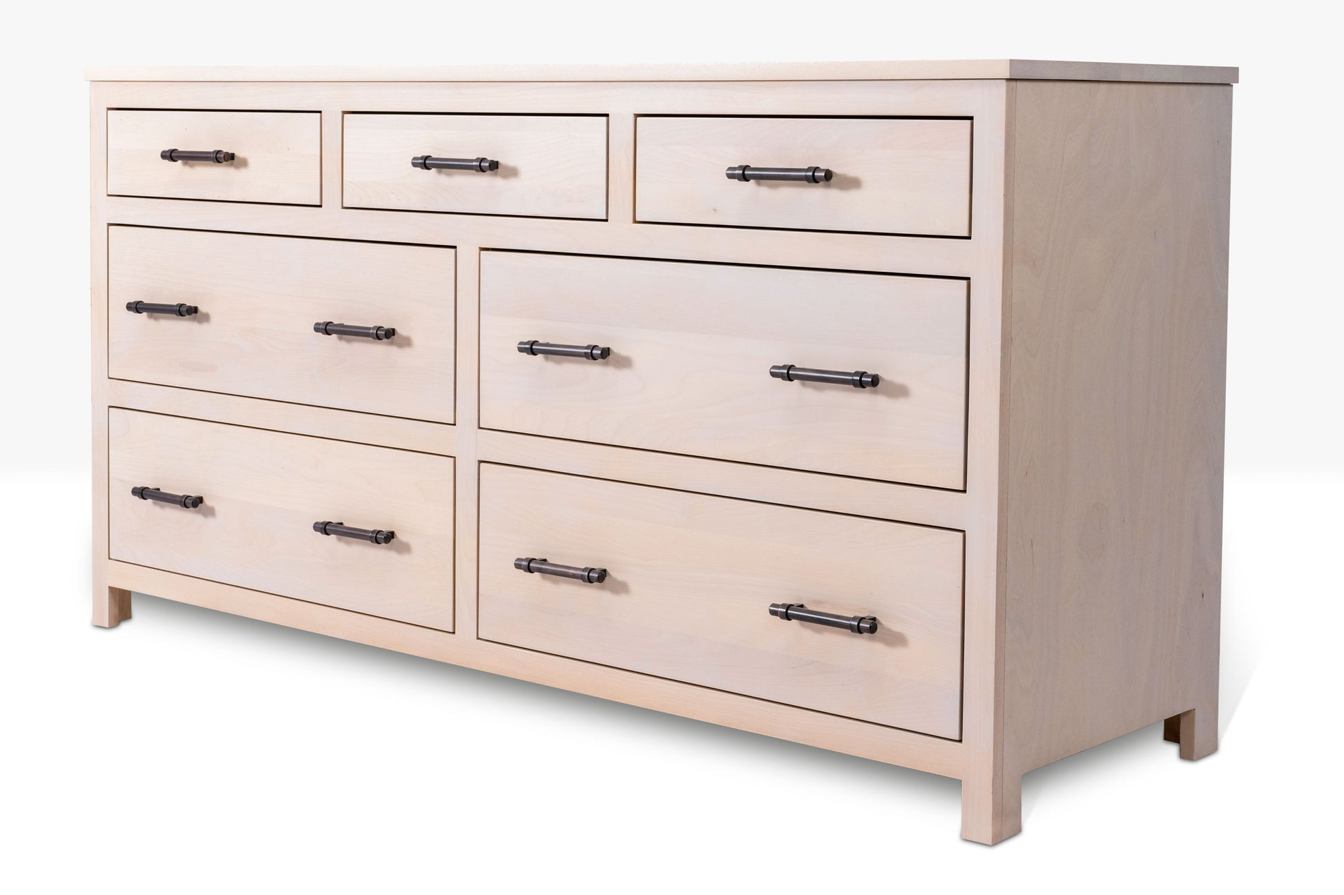 Acadia Tremont Seven Drawer Dresser features four large drawers and three small drawers on the top row. Pictured in Sandstone Finish close up to highlight details.