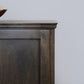Berkshire Plymouth Cabinet shown in Foggy Oak finish, shown close up to highlight crown moulding details.