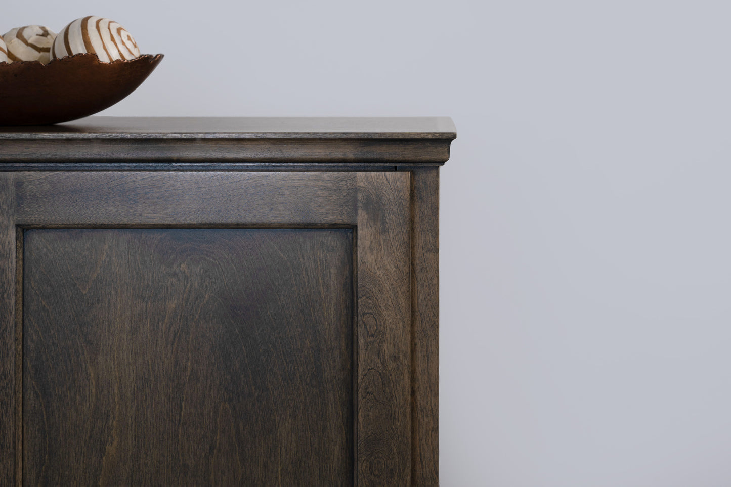 Berkshire Plymouth Cabinet shown in Foggy Oak finish, shown close up to highlight crown moulding details.