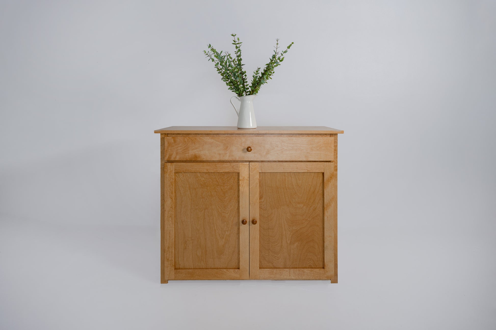 Berkshire Shaker Cabinet with Drawers features adjustable shelving and birch construction. Shown in Golden Oak Finish.