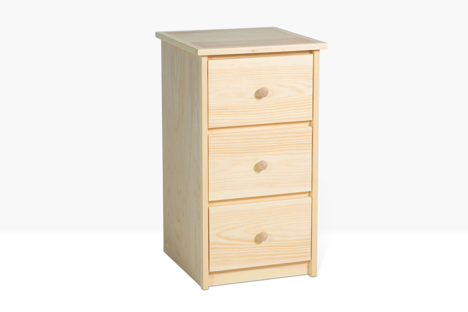 Evergreen Three Drawer Nightstand shown from side angle to show details of pine construction. Shown unfinished.